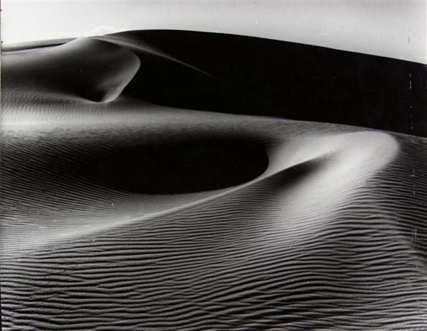 HARRY VROMAN (American) Vintage gelatin silver pr: Harry Vroman (American, 1889 - 1983). "At White Sands, New Mexico". Vintage gelatin silver print. c1930s. Printed c1930s. Photographer's stamp, verso. 10 7/8 x 14 in. (276 x 356 mm). Provenance: Estat