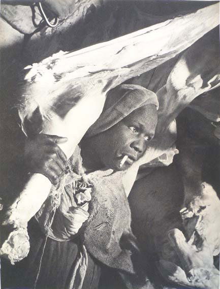 BRASSAI (Hungarian/French) Original vintage photog: Brassai (Hungarian/French, 1899-1984). "Porteur de Viande". Original vintage photogravure. c1938. Printed 1938. 11 15/16 x 9 1/16 in. (303 x 230 mm). [23543]