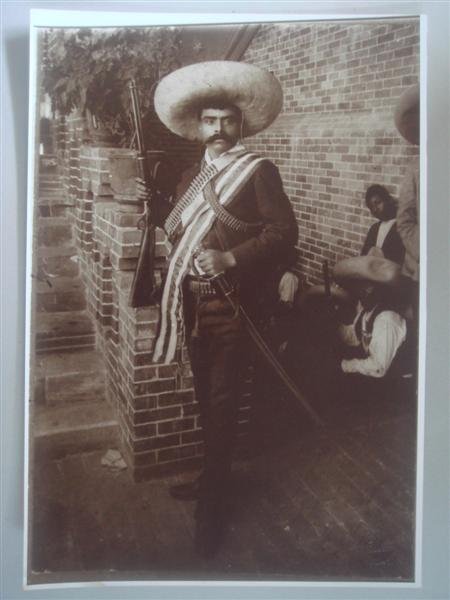 AUGUSTIN VICTOR CASASOLA (Mexican) Gelatin silver : Augustin Victor Casasola (Mexican, 1874 - 1938). "Emiliano Zapata con Rifle [Mexico] [Mammoth plate format]". Gelatin silver print. c1910. Printed later from the original negative. Casasola Studios em
