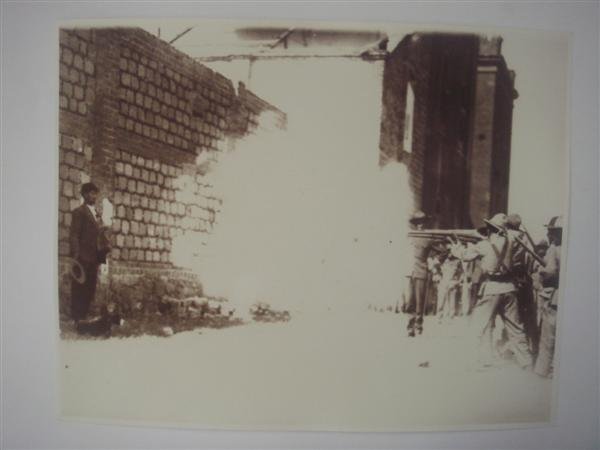 AUGUSTIN VICTOR CASASOLA (Mexican) Gelatin silver : Augustin Victor Casasola (Mexican, 1874 - 1938). "Fortino Samano [III] Recibiendo Descarga [Mexico]". Gelatin silver print. 1917. Printed later from the original negative. Casasola Studios embossed bl
