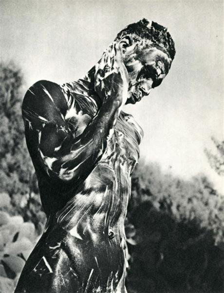 HERBERT LIST (German) Original vintage photogravur: Herbert List (German, 1903-1974). "Nude Black Male Soaping Himself". Original vintage photogravure. c1934. Printed 1935. 8 5/8 x 6 5/8 in. (219 x 168 mm). [24161]