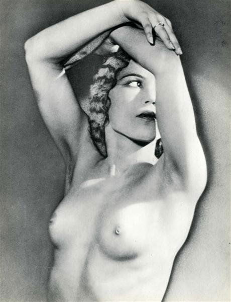 MAN RAY (American) Original vintage photogravure: Man Ray (American, 1890 - 1976). "Femme Nu avec les Bras Augmentes [descriptive title]". Original vintage photogravure. c1931. Printed 1932. 12 x 9 1/4 in. (305 x 235 mm). Fine condition. Image copyri