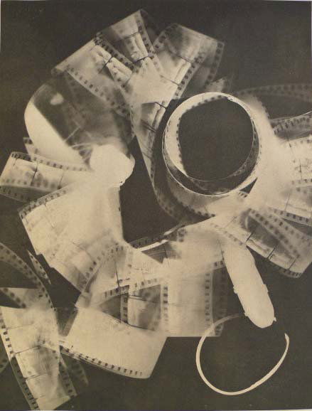 MAN RAY (American) Original vintage photogravure: Man Ray (American, 1890 - 1976). "Rayograph - Film Strip Roll Up". Original vintage photogravure. 1923. Printed 1934. Signed "Man Ray" in the negative, lower right. 10 5/16 x 8 1/8 in. (262 x 206 mm).