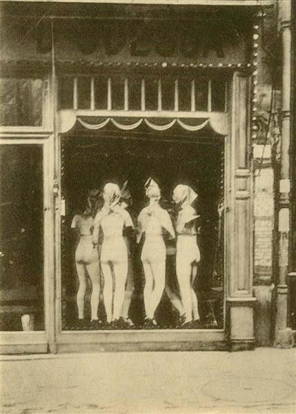 ANDRE KERTESZ (Hungarian/American) Original vintag: Andre Kertesz (Hungarian/American, 1894-1985). "Devanture". Original vintage photogravure. c1929. Printed 1929. 4 11/16 x 3 5/16 in. (119 x 84 mm). [24903]