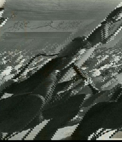 WILLY RONIS (French) Original vintage photogravure: Willy Ronis (French, 1910-2009). "La Rose Rouge [Full title: La Rose Rouge. Anita Love, La Meilleure Chanteuse de France, Maurice Meunier, Clarinette, Armand Conrad, Saxo Tenor]". Original vintage pho