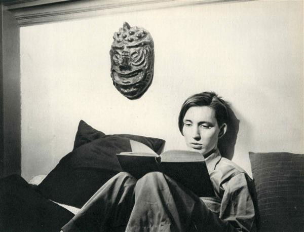 MINOR WHITE - Original vintage photogravure: Minor White (American, 1908-1976). "Boy Reading Book [Two Masks]". Original vintage photogravure. 1942. Printed 1947. 6 9/16 x 8 5/8 in. (167 x 219 mm). [23852]