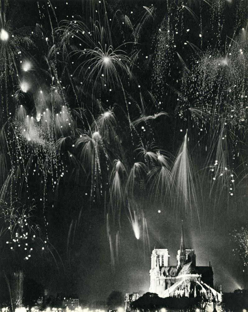 ANDRE DE DIENES - Original vintage photogravure: Andre de Dienes (Romanian/American, 1913 - 1985). "Fireworks over Notre-Dame, Paris". Original vintage photogravure. c1937. Printed 1937. Image size: 11 3/4 x 9 5/16 in. (298 x 237 mm). [23890]