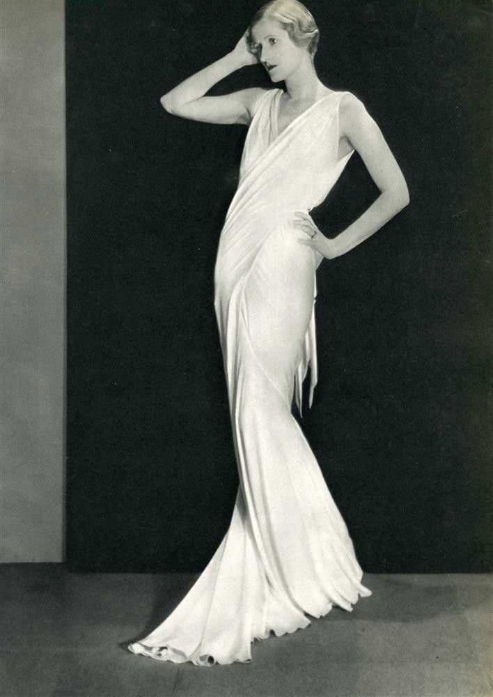 MAN RAY - Original vintage photogravure: Man Ray (American, 1890 - 1976). "Long White Dress [descriptive title]". Original vintage photogravure. c1934 (incorrectly catalogued by the Man Ray Trust as 1935). Printed 1934. See: www.manraytrust.