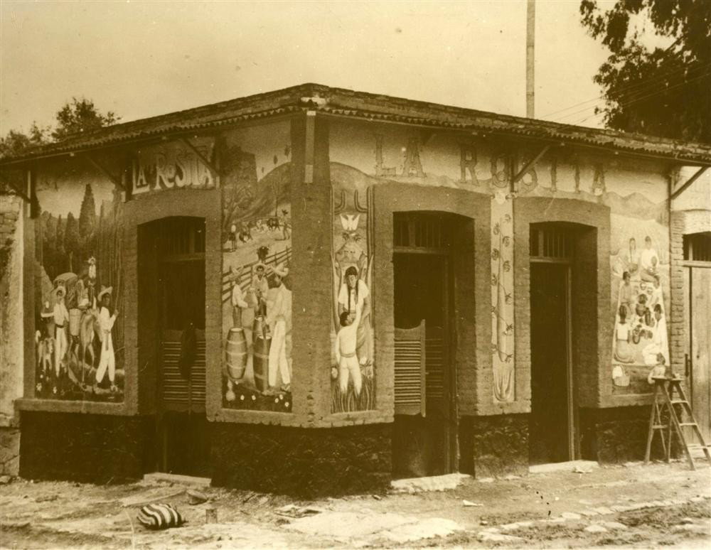 AGUSTIN VICTOR CASASOLA - Gelatin silver print: Agustin Victor Casasola (Mexican, 1874 - 1938). "La Rosita Pulqueria, Pint. por Frida Kahlo [Mexico]". Gelatin silver print. c1935. Printed later from the original negative. Casasola Studios embossed 