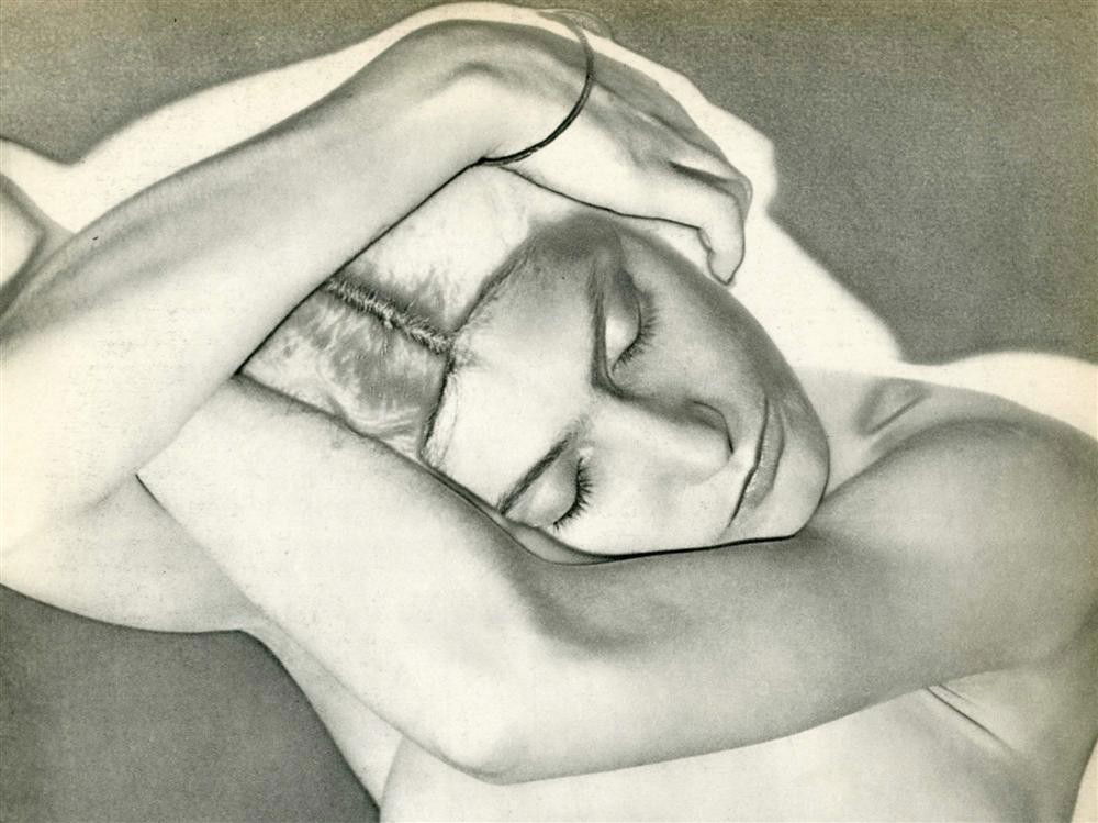MAN RAY - Original vintage photogravure: Man Ray (American, 1890 - 1976). "Sleeping Woman (Woman on Folded Arms) [solarization]". Original vintage photogravure. 1931. Printed 1934. Signed in the negative, partially visible in the photogravur