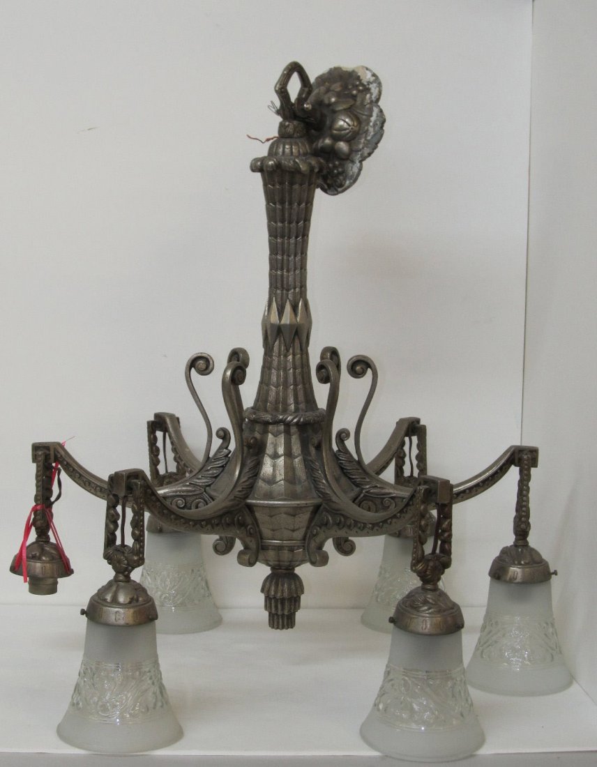 AMERICAN SCHOOL [20TH CENTURY] - Lighting - Chande: American School [20th Century]. "Metal Patinated Chandelier". Lighting - Chandelier. c1920s. One socket detached but present; rewired; one shade broken but present; almost for sure not original shades