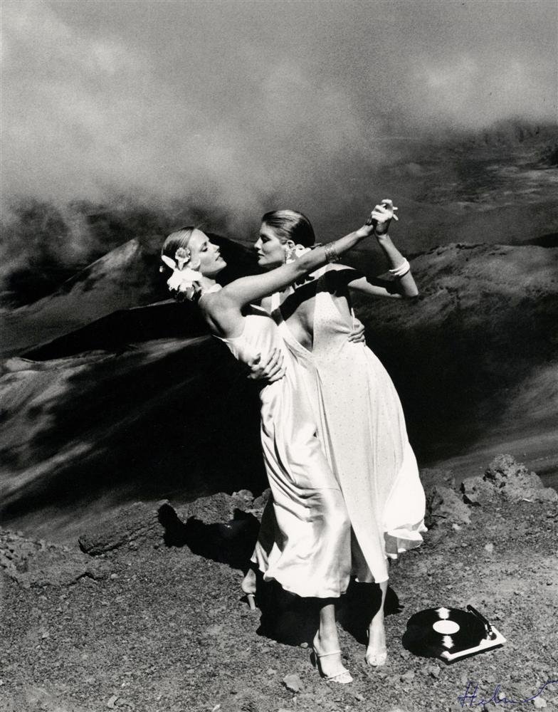 HELMUT NEWTON - Photolithograph: Helmut Newton (German/Australian, 1920-2004). "Dancing on a Volcano, American Vogue [Maui, Hawaii]". Photolithograph. 1974. Printed 1995. Signed "Helmut" in pen, lower right. Fine, quality printing. V