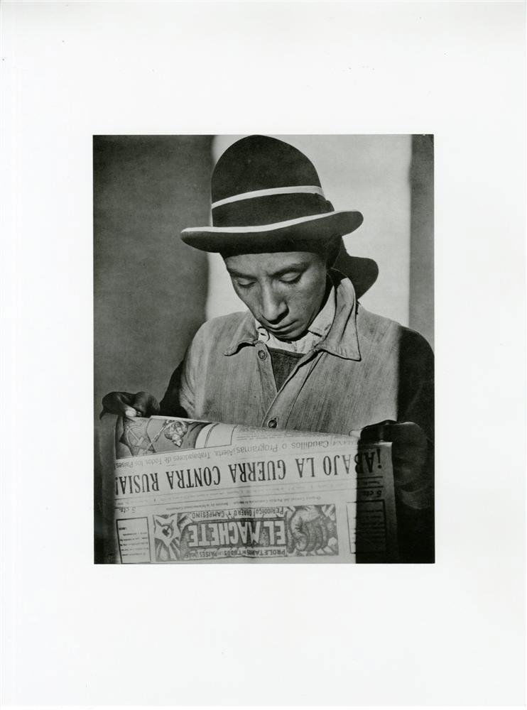 TINA MODOTTI - Original photogravure: Tina Modotti (Italian/American, 1896 - 1942). "Worker Reading "El Machete" Newspaper". Original photogravure. 1926/27. Printed later. Fine condition; with tissue guard. Image size: 9 1/2 x 7 9/16 in.
