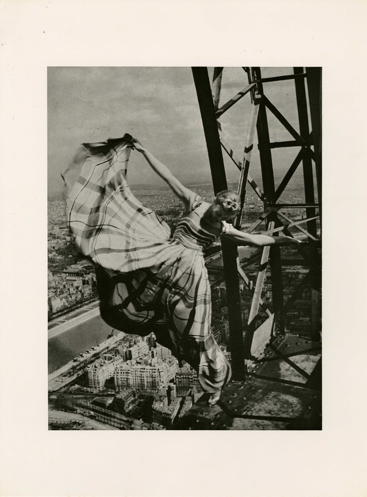 ERWIN BLUMENFELD - Lisa Fonssagrives on the Eiffel Tower - Original photogravure: Artist: Erwin Blumenfeld (German-American, 1897-1969). Title: "Lisa Fonssagrives on the Eiffel Tower [For Vogue - Dress by Lelong]". Medium: Original photogravure. Date: Composed 1939. Printed later.
