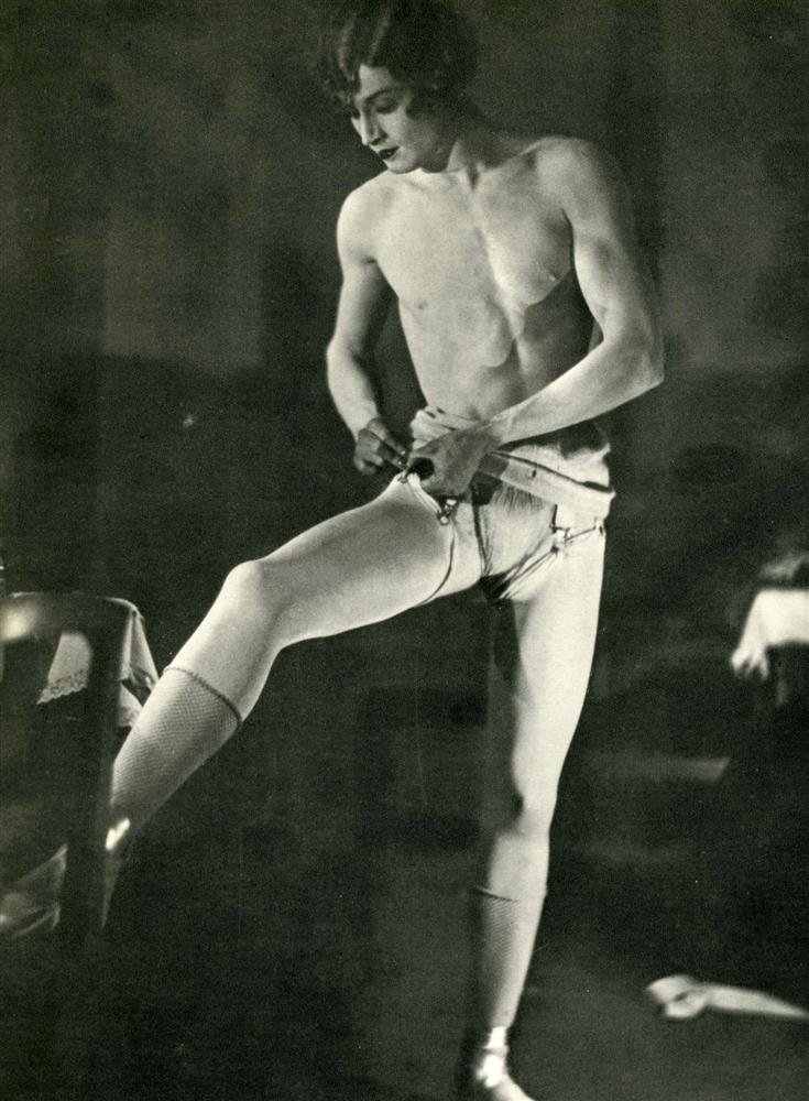 MAN RAY - Original vintage photogravure: Man Ray (American, 1890 - 1976). "Barbette Dressing". Original vintage photogravure. 1926. Printed 1934. A male dancer in drag, adjusting "her" stockings. "A popular vaudeville performer of the 1920s 