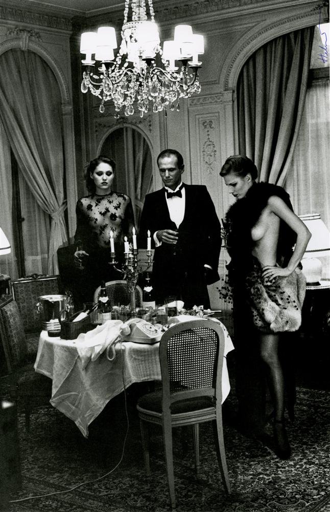 HELMUT NEWTON - Photolithograph: Helmut Newton (German/Australian, 1920-2004). "Hotel Suite I, After Dinner, Paris". Photolithograph. c1977. Printed 1999. Signed in pen, upper right. Fine, quality printing. Very good to fine conditio
