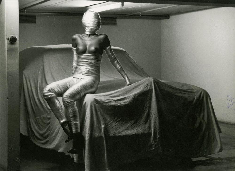 HELMUT NEWTON - Photolithograph: Helmut Newton (German/Australian, 1920-2004). "In My Garage [Monte Carlo]". Photolithograph. 1986. Printed 2000. Signed with the initials in pen, lower right. Fine, quality printing. Very good conditi