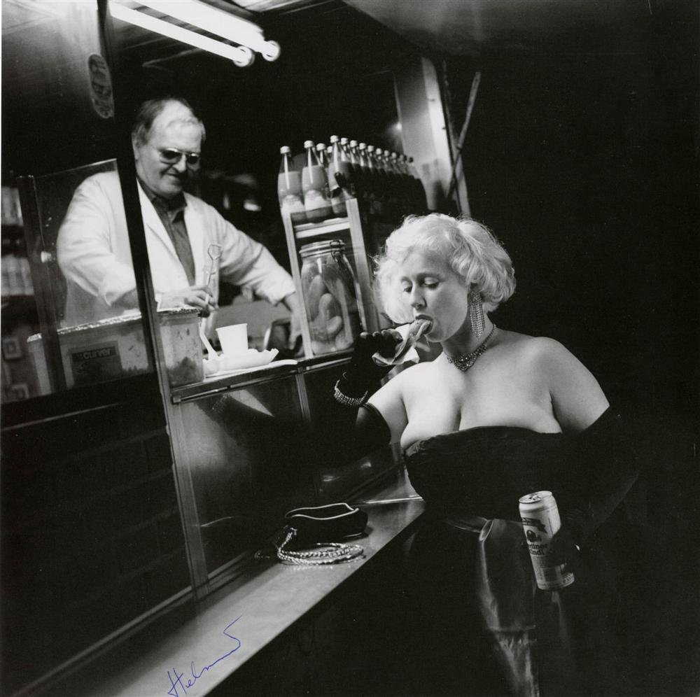 HELMUT NEWTON - Photolithograph: Helmut Newton (German/Australian, 1920-2004). "Wurstmaxe and Consumer [Berlin]". Photolithograph. 1991. Printed 1997. Signed "Helmut" in pen, lower left. Fine, quality printing. Very good condition. P