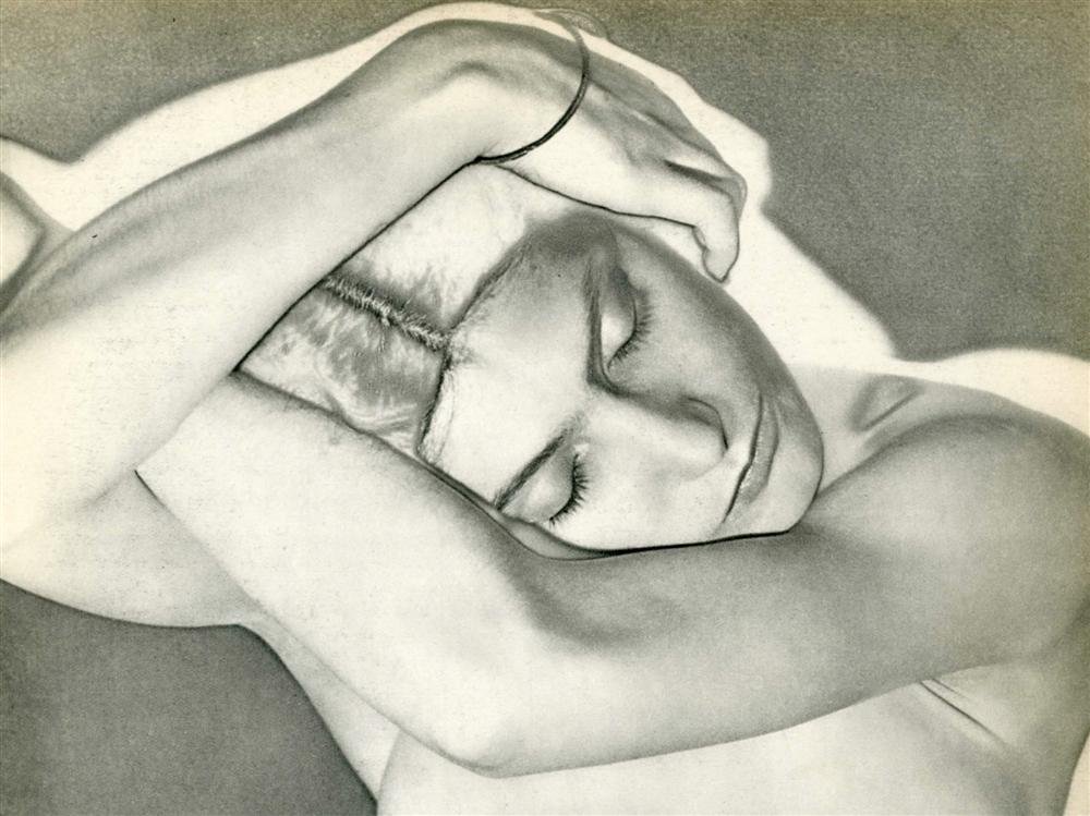 MAN RAY - Original vintage photogravure: Man Ray (American, 1890 - 1976). "Sleeping Woman (Woman on Folded Arms) [solarization]". Original vintage photogravure. 1931. Printed 1934. Signed in the negative, partially visible in the photogravur
