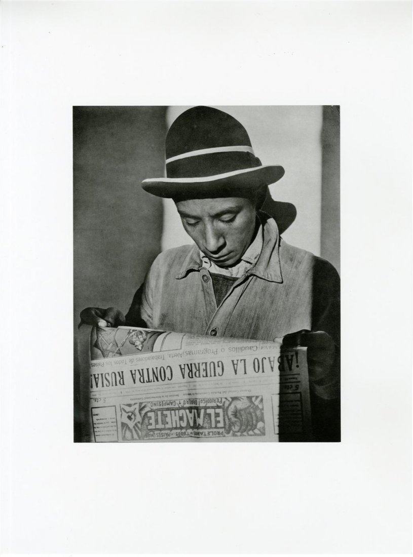 TINA MODOTTI - Original photogravure: Tina Modotti (Italian/American, 1896 - 1942). "Worker Reading "El Machete" Newspaper". Original photogravure. 1926/27. Printed later. Fine condition; with tissue guard. Overall size: 15 11/16 x 11 5/8