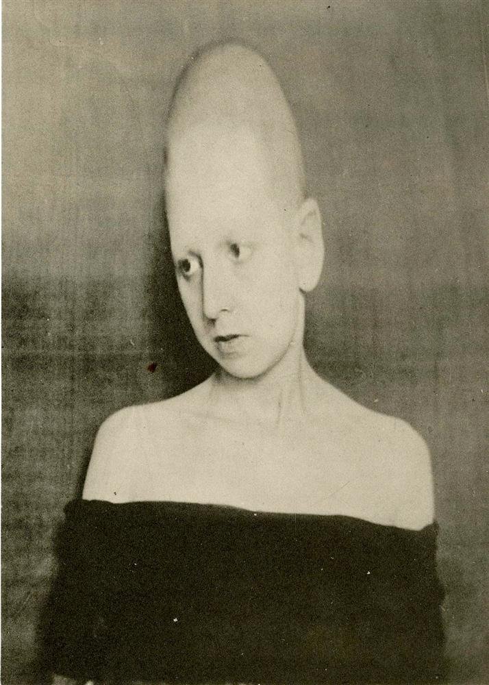 CLAUDE CAHUN - Original vintage photogravure: Claude Cahun (French, 1894-1954). "Frontiere Humaine". Original vintage photogravure. c1930. Printed 1930. Cahun was born Lucy Renee Mathilde Schwob. Image size: 6 1/8 x 4 3/8 in. (156 x 111 mm). [249