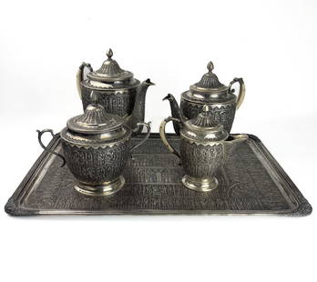 A PERSIAN SILVER TEA OR COFFEE SERVICE, IRAN, PAHLAVI ERA: A PERSIAN SILVER TEA OR COFFEE SERVICE, IRAN, PAHLAVI ERA 1. TEAPOT - 18 CM H. 550 G 2. COFFEE POT - 20 CM H. 677 G 3. MILK/CREAM PITCHER - 13 CM H, 310 G. 4. SUGAR BOWL - 15 CM H., 400 G. 5. SILVER T