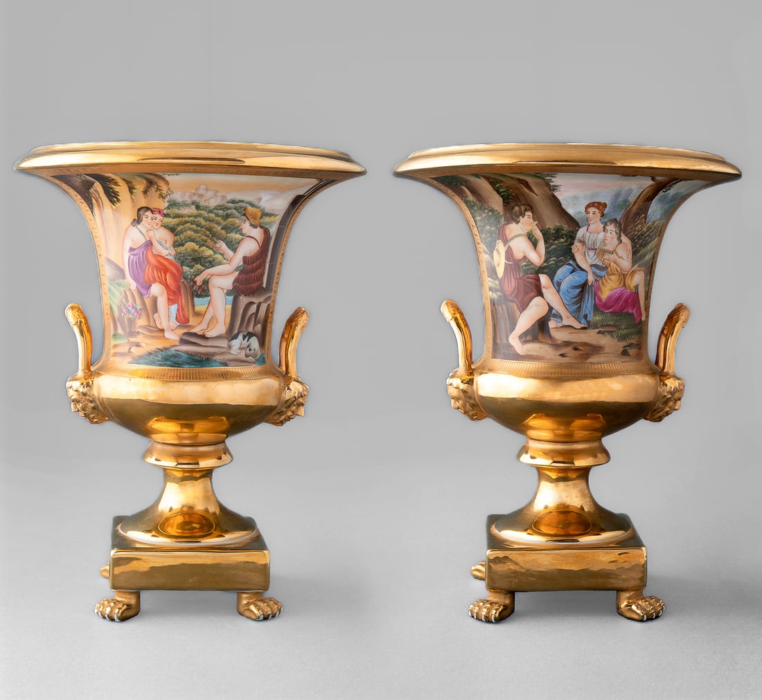 A PAIR OF MEDICI VASES WITH GENRE SCENES, 20TH C: A PAIR OF MEDICI VASES WITH GENRE SCENES, 20TH C GILDED 'SP' MARK IMPRESSED ON THE BOTTOM. GENRE SCENES PAINTED ON THE BODIES. ENGRAVED DECORATION WITH CORNUCOPIAS AND GARLANDS. IN THE UPPER PART- AN 