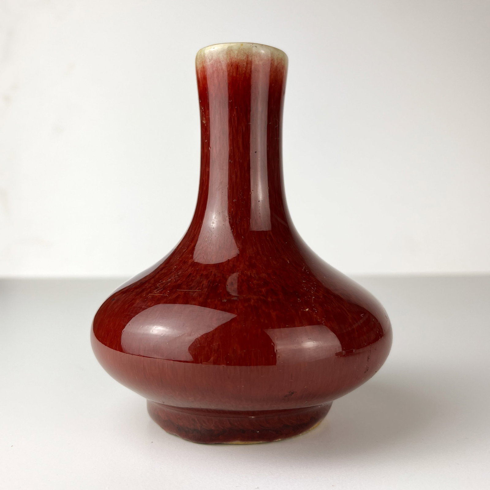 A SMALL CHINESE FLAMBE-GLAZED BOTTLE VASE, 18TH CENTURY (1 of 1)