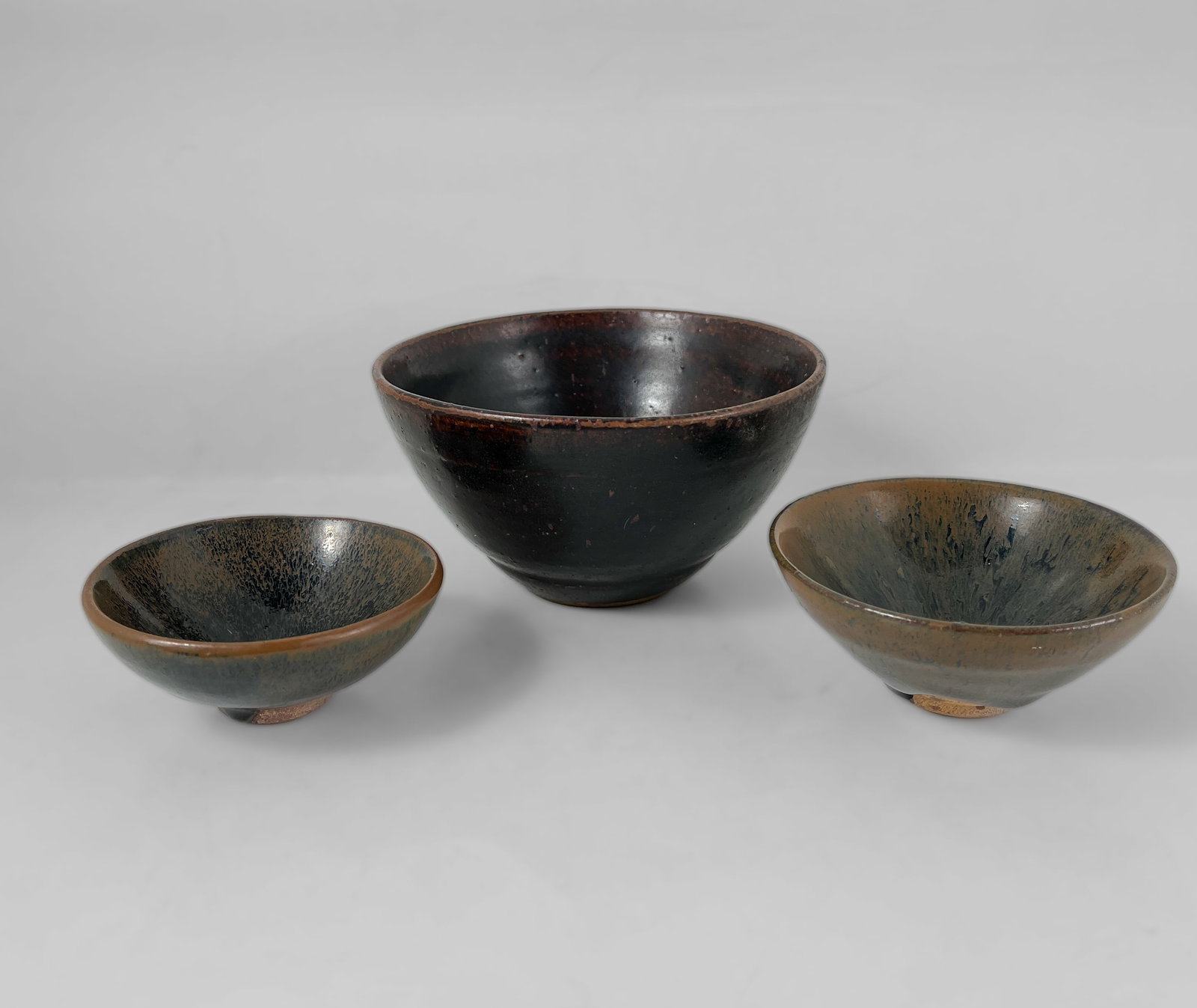 A RARE CHINESE 'CIZHOU'BLACK-GLAZED TEA BOWL, AND TWO SMALL 'JIAN'TEA BOWL, SONG-YUAN DYNASTY. (1 of 1)