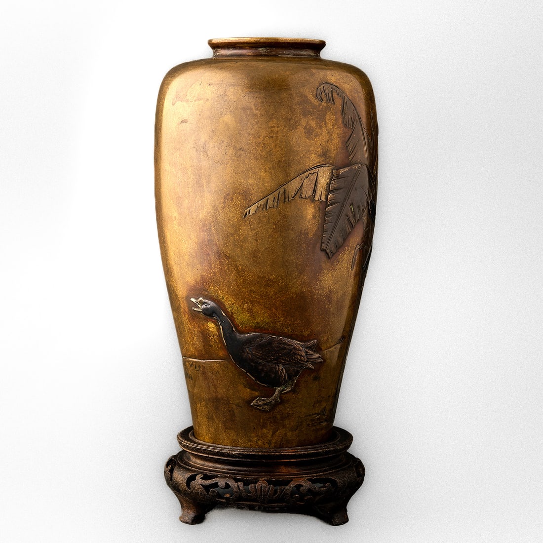 VASE DECORATED WITH A MOTIF OF A DUCK AND A BANANA TREE, JAPAN, MEIJI PERIOD (1868-1912): VASE DECORATED WITH A MOTIF OF A DUCK AND A BANANA TREE, JAPAN, MEIJI PERIOD (1868-1912) PATINATED BRONZE, ROE HIRAZOGAN DECORATION TECHNIQUE USING VARIOUS METALS AND ALLOYS (COPPER, SILVER, GILDING) 