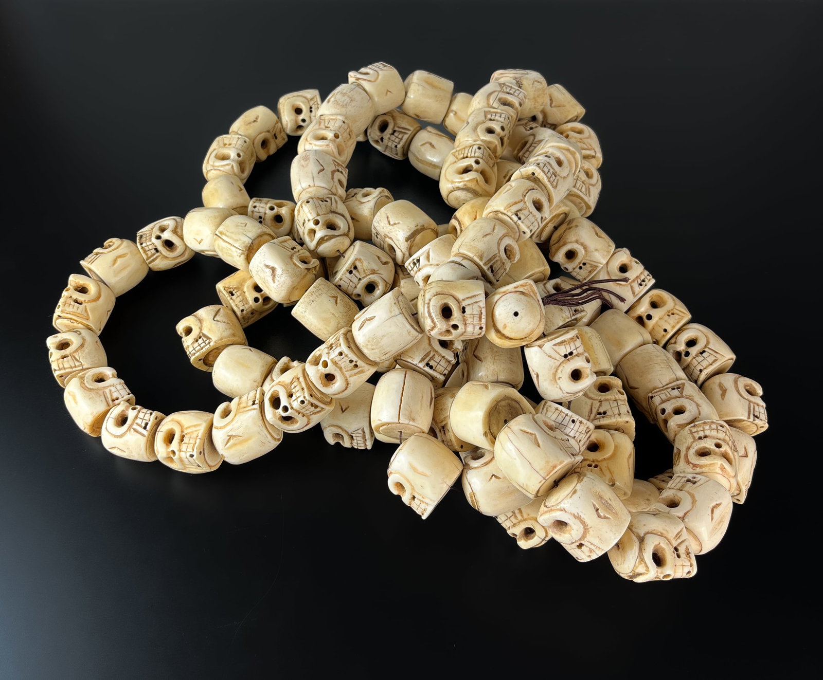 A TIBETAN MALA MADE OF YAK BONE CARVED INTO BIG BEADS (1 of 1)
