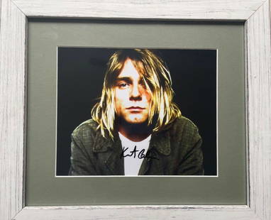 Kurt Cobain - Hand Signed, Photograph: KURT COBAIN (1967–1994) Photograph Hand-signed in black ink by Kurt Cobain, this rare 8 x 10 inch glossy photograph captures the iconic frontman of Nirvana at the height of his influence. Authentic
