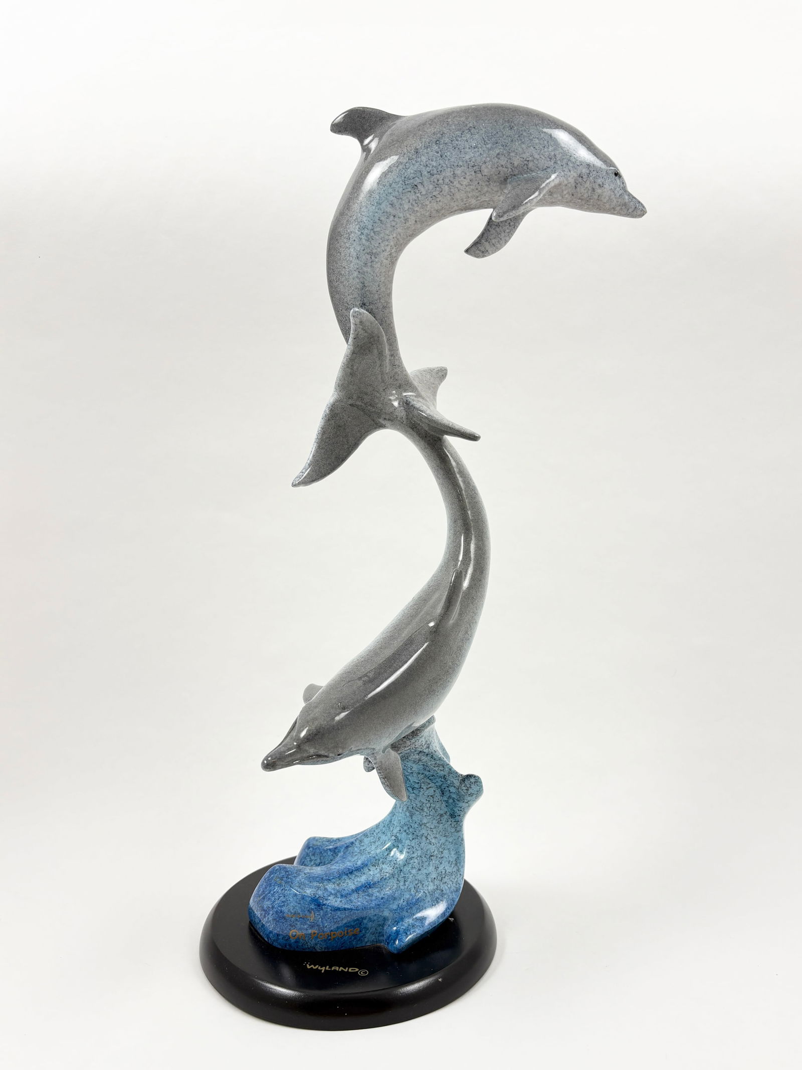 Robert Wyland - On Porpoise, Porcelain Sculpture: ROBERT WYLAND (B. 1956) On Porpoise Porcelain Sculpture A graceful depiction of a dolphin mid-leap, executed in fine porcelain with Wyland’s characteristic attention to marine life movement and anat