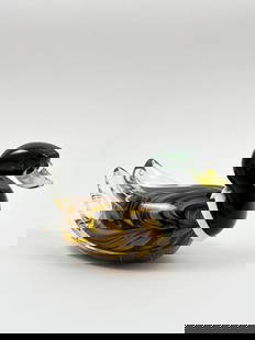 MURANO – ART GLASS DUCK SCULPTURE: MURANO – ART GLASS DUCK SCULPTURE Hand-blown glass with rich amber, green, and black swirls Attributed to Murano, Italy A charming example of Murano glass artistry, this stylized duck sculpture