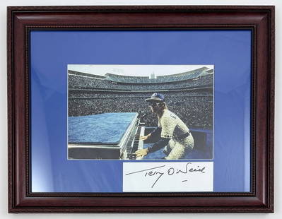 Terry O'Neill - Elton John Performing, 1975 (Hand Signed): TERRY O'NEILL (1938–2019) Elton John Performing at Dodger Stadium in Los Angeles, 1975 Hand signed print capturing the legendary Elton John during a dynamic 1975 performance at Dodger Stadium. Renow