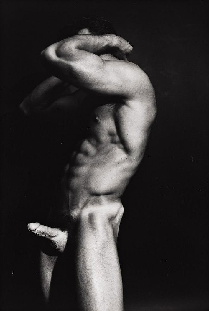 TOM BIANCHI — Statue (Print), 12.5 × 18 in: TOM BIANCHI (American, b. 1945) Statue Medium: Print Striking black-and-white male nude study by Tom Bianchi, renowned for his intimate and candid depictions of the male form. The image emphasizes mus