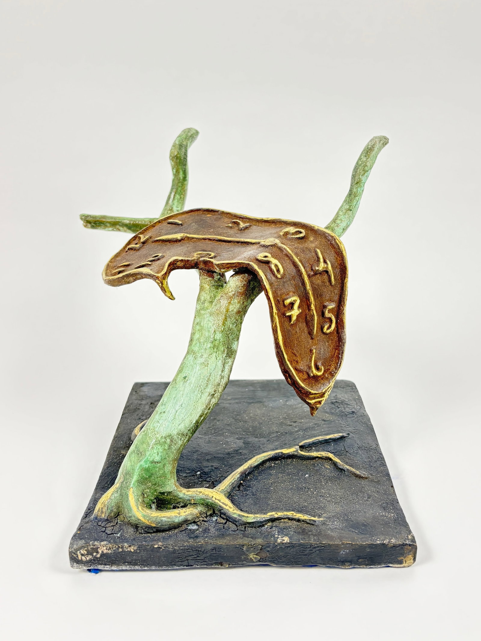 SALVADOR DALÍ – “Melted Clock” Bronze Sculpture: SALVADOR DALÍ – “Melted Clock” Bronze Sculpture Striking bronze sculpture inspired by the surrealist master Salvador Dalí, depicting his iconic “melted clock” draped over a tree br