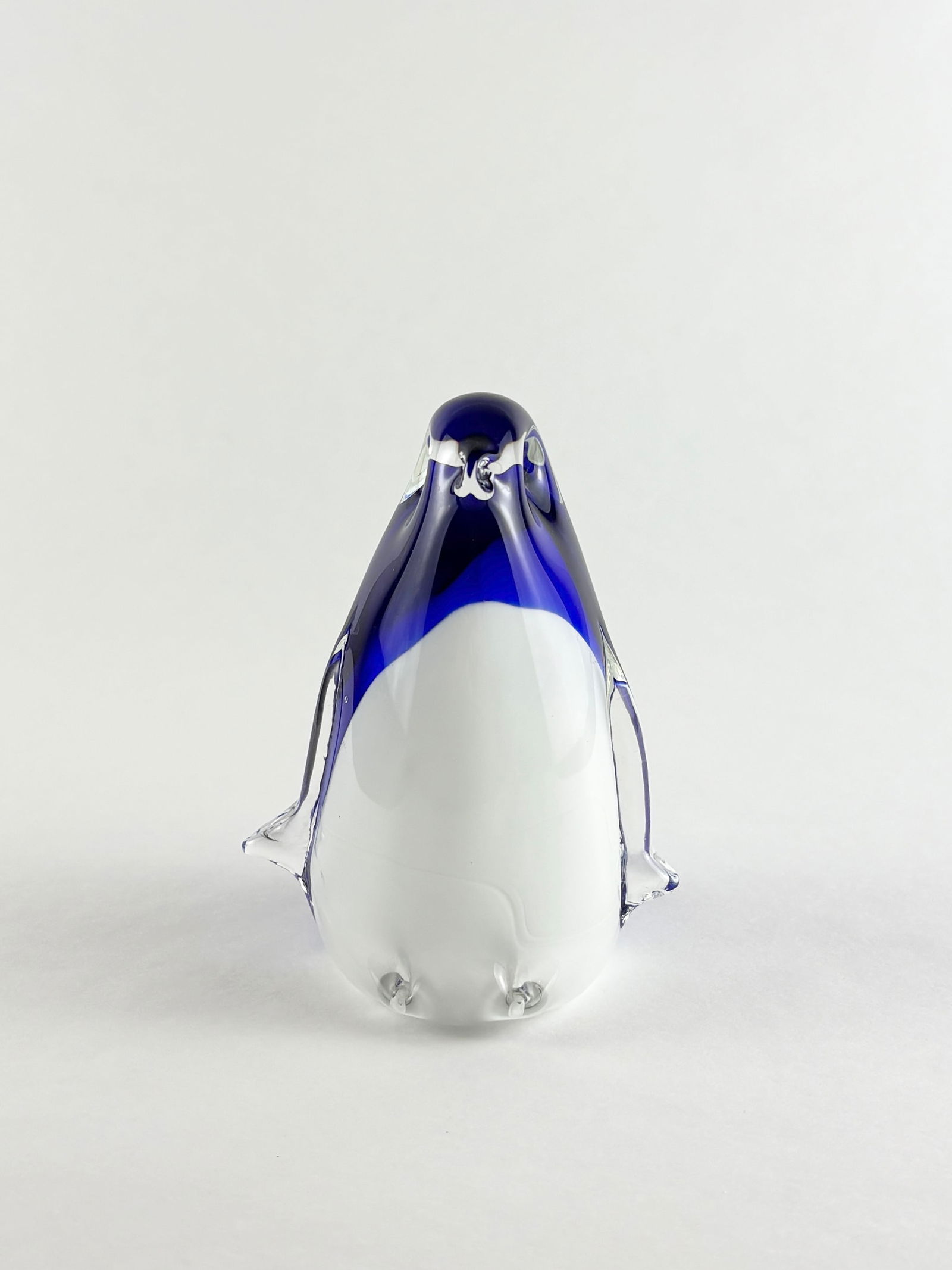 Art Glass Penguin, Murano Style: Art Glass Penguin, Glass Penguin Glass Height: 4.5 inches A decorative art glass penguin with clear and blue detailing.