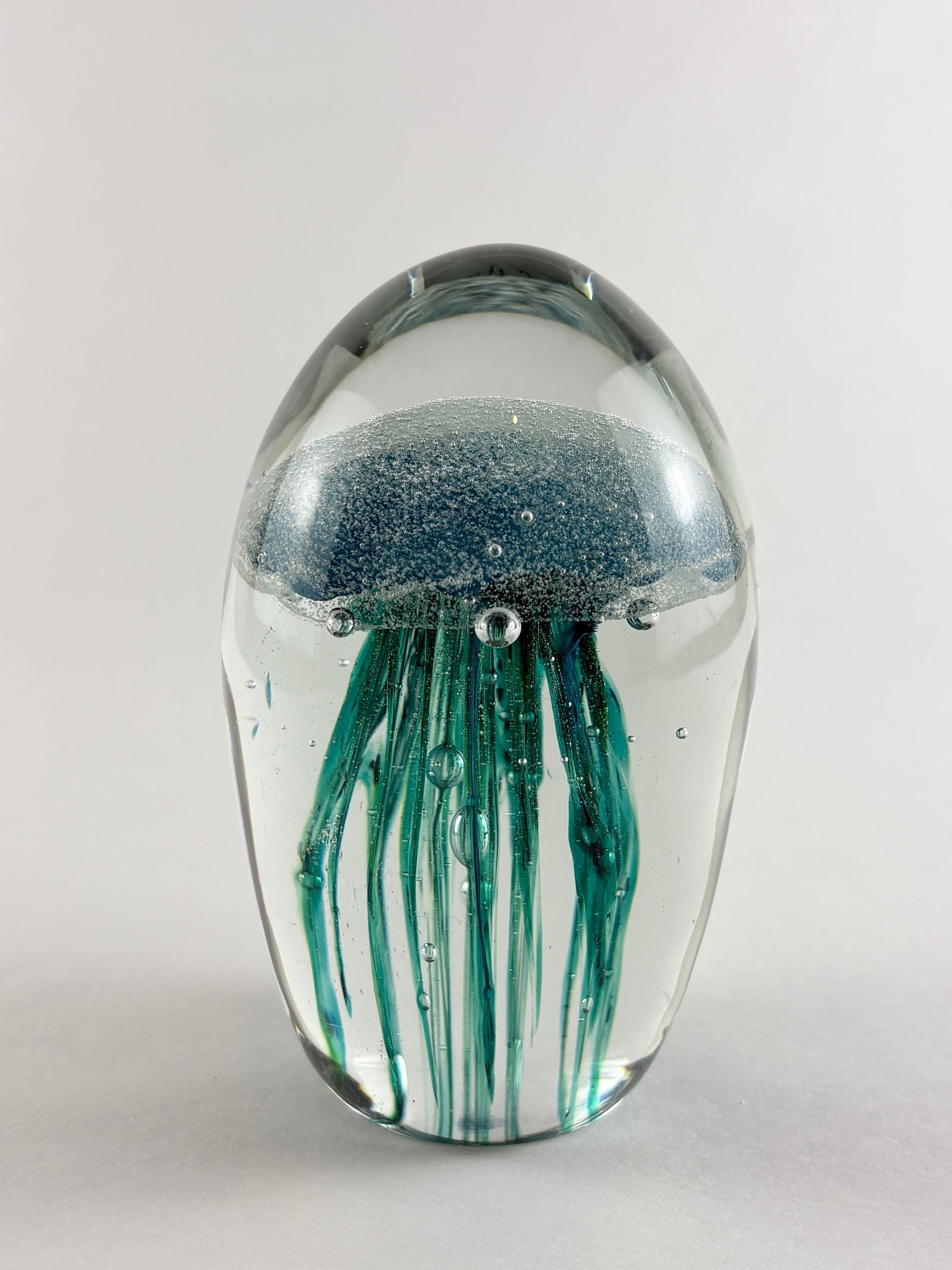 Art Glass Jellyfish: Art Glass Jellyfish, Glass Jellyfish Glass Height: 4 inches A decorative art glass jellyfish with suspended tentacle detailing encased within a clear glass form.