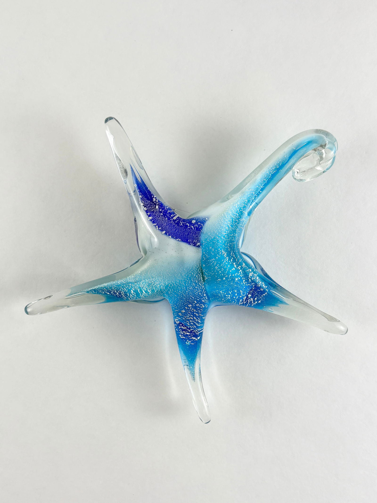 Art Glass Starfish: Art Glass Starfish, Glass Starfish Glass Height: 5 inches A decorative art glass starfish with blue-toned coloring and clear extended arms