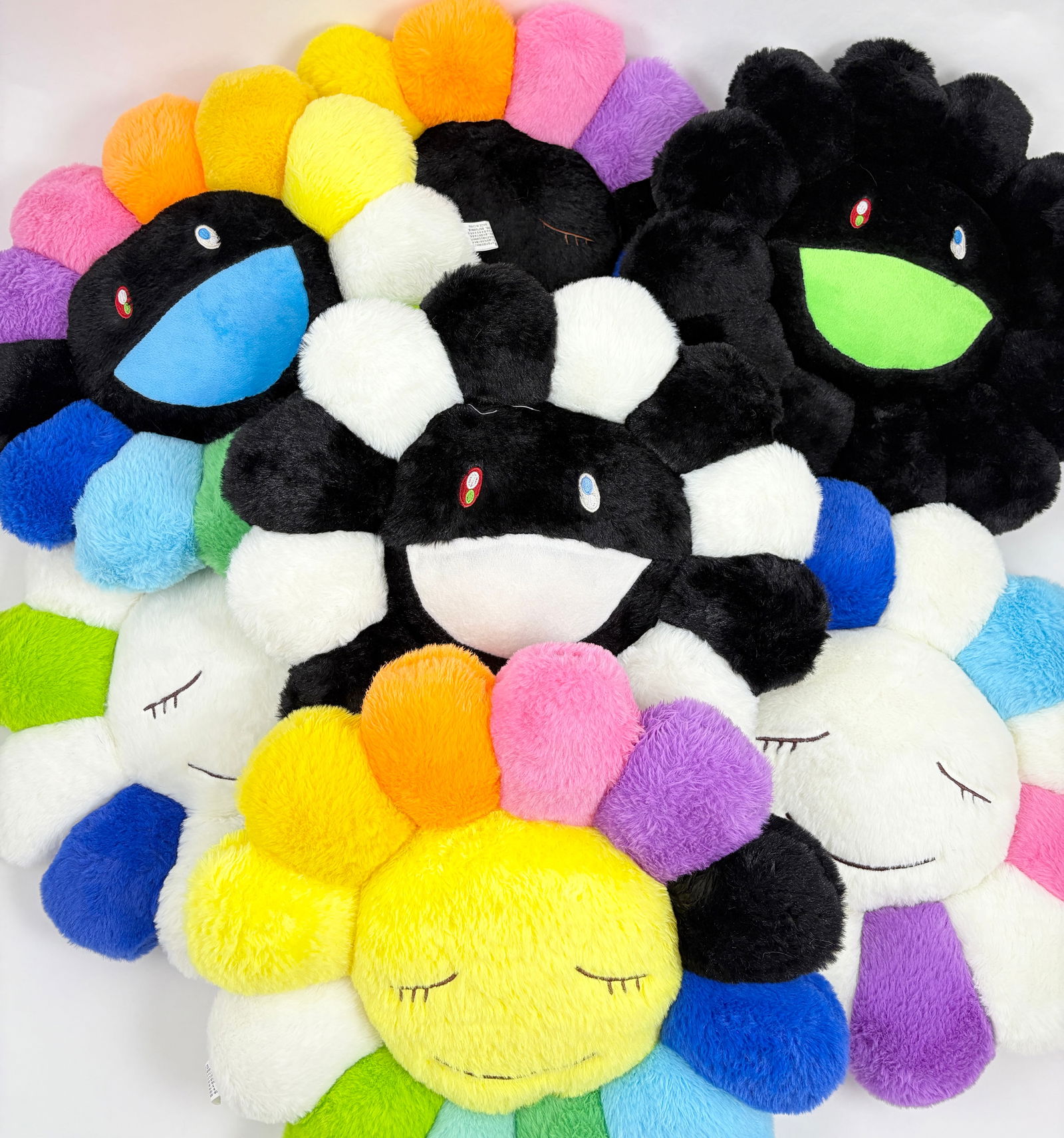 Takashi Murakami - Lot of 7 Plush Pillows: Takashi Murakami, Lot of 7 Plush Pillows mixed media (polyester fiber and fabric) various dimensions A vibrant collection of seven flower-shaped plush pillows by renowned Japanese artist Takashi Murak