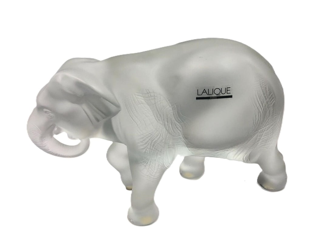Lalique – Elephant Crystal Figurine: Lalique Elephant Figurine 20th century, France frosted crystal approximately 7.5 inches high x 10.5 inches wide x 4 inches deep This crystal elephant figurine depicts the animal in a standing pose