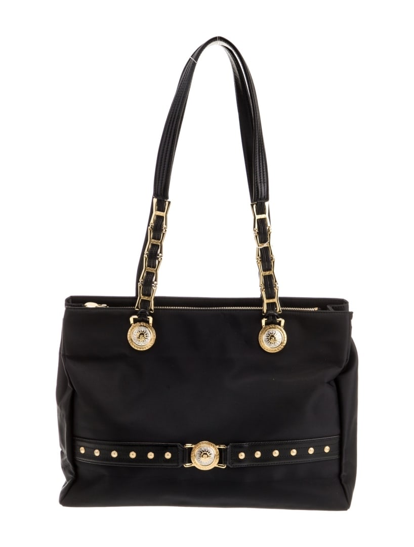 Versace Black Nylon Leather Trim Shoulder Bag: Condition is Very Good, pre-owned. Details: Black Nylon, Gold-Tone Hardware, Leather Trim, Dual Shoulder Straps, Leather Trim Embellishment, Leather Lining, Dual Interior Pockets, Snap Closure at Top,