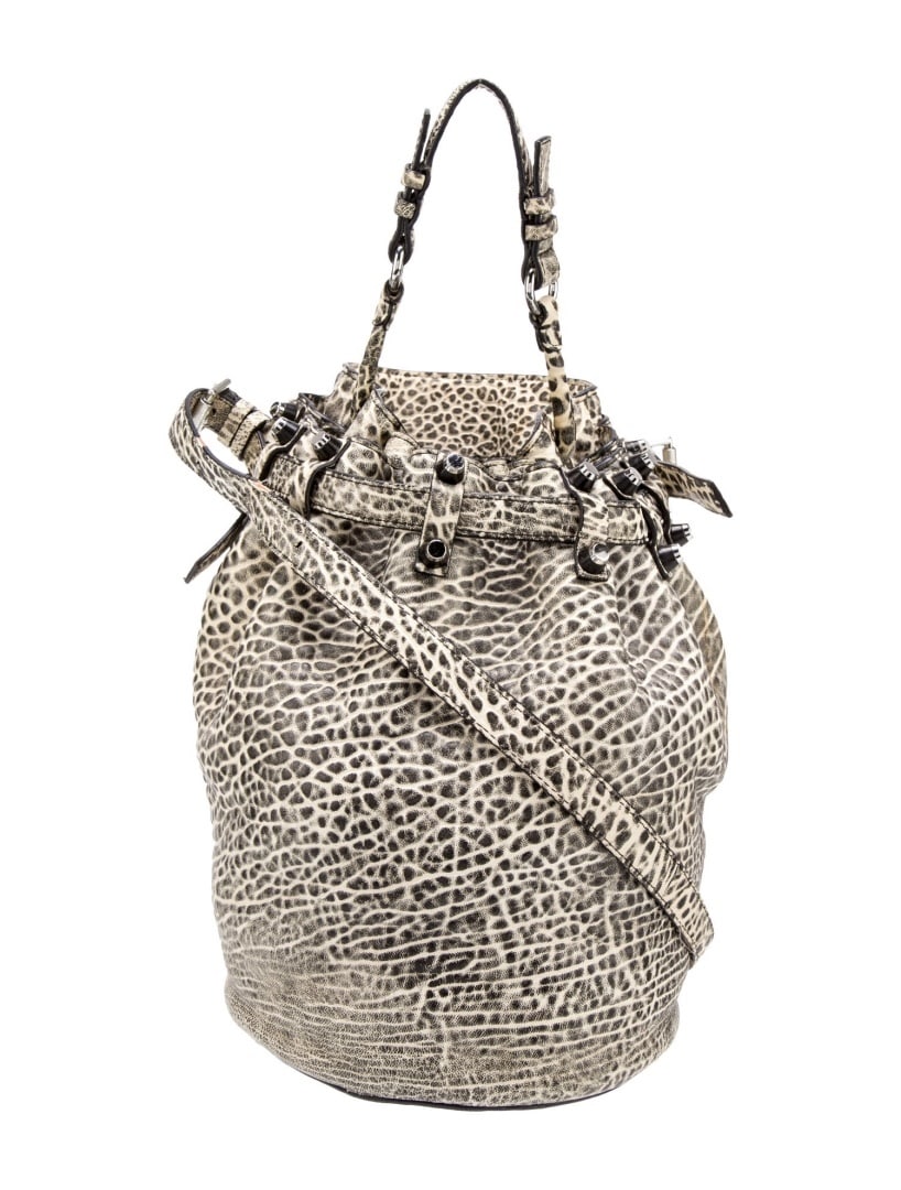 Alexander Wang Black Animal Print Bucket Bag: Condition is Very Good, pre-owned. Details: Black Leather, Animal Print, Tonal Hardware, Flat Handle, Single Adjustable Shoulder Strap, Studded Accents, Satin Lining, Single Interior Pocket, Open Top,