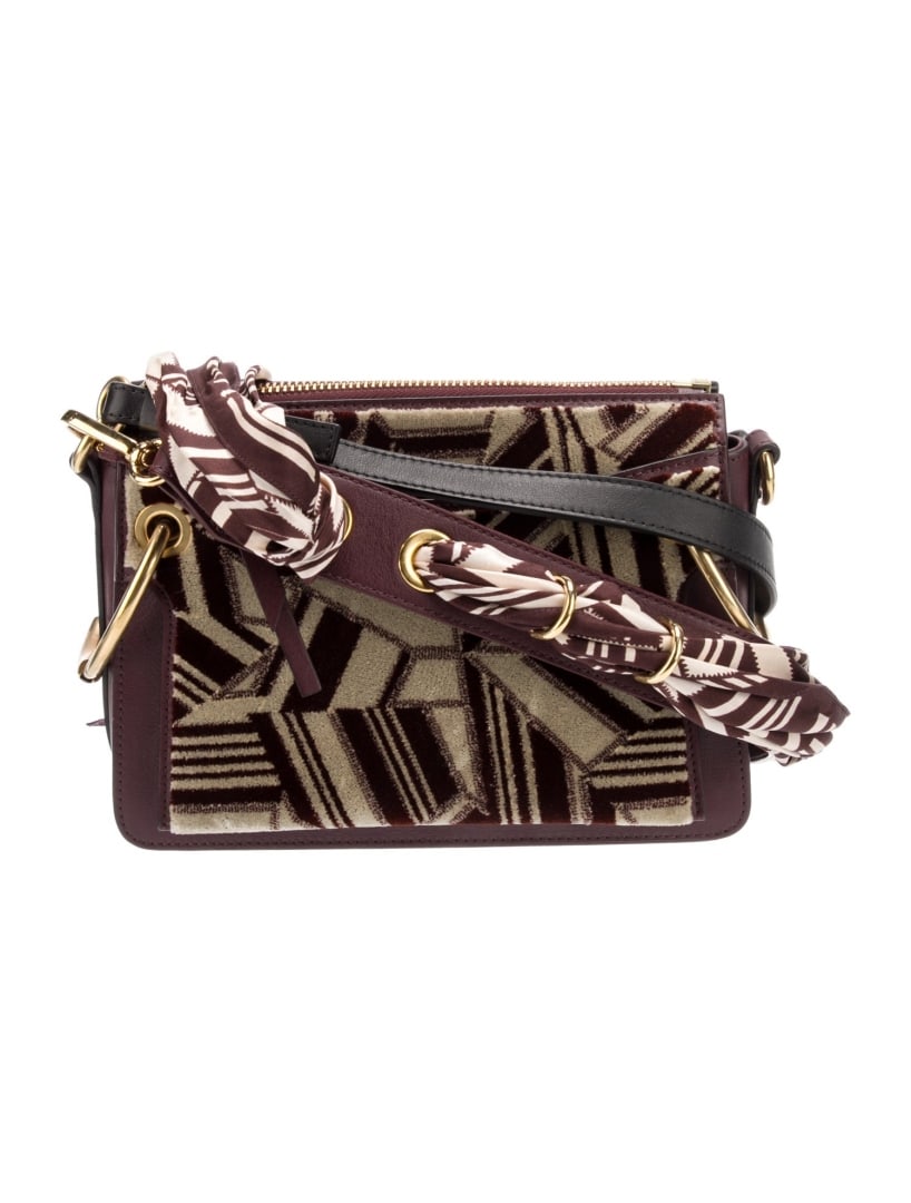 Chloe Burgundy Leather Printed Shoulder Bag: Condition is Very Good, pre-owned. Details: Burgundy Leather, Printed, Gold-Tone Hardware, Flat Handle, Single Shoulder Strap, Single Exterior Pocket, Canvas Lining, Three Interior Pockets, Zip Closur