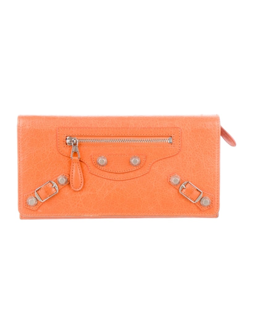 Balenciaga Orange Lambskin Continental Wallet: Condition is Very Good, pre-owned. Details: From the Spring/Summer 2013 Collection by Alexander Wang, Orange Lambskin, Gold-Tone Hardware, Single Exterior Pocket, Leather Lining, Three Interior Pocket