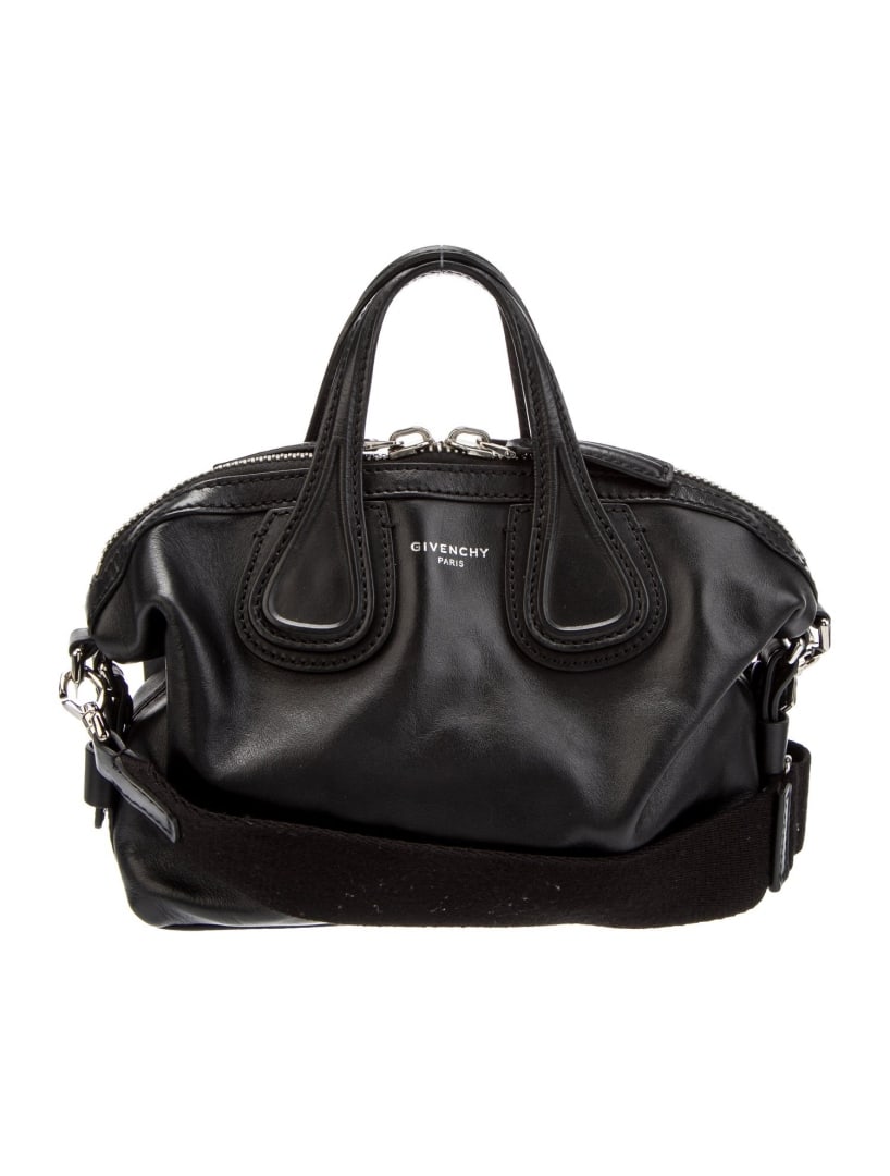 Givenchy Black Leather Zip Closed Weekender Bag: Condition is very good, pre-owned. Details: black leather, silver-tone hardware, flat handles, single adjustable shoulder strap, canvas lining, dual interior pockets, zip closure at top, shoulder stra