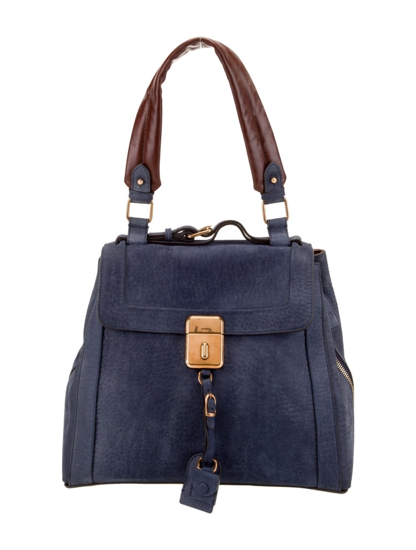 Chloe Blue Suede Push-lock Closure Shoulder Bag: Condition is very good, pre-owned. Details: blue suede, gold-tone hardware, handle, single shoulder strap, canvas lining, single interior pocket, push-lock closure at front, protective feet at base, s