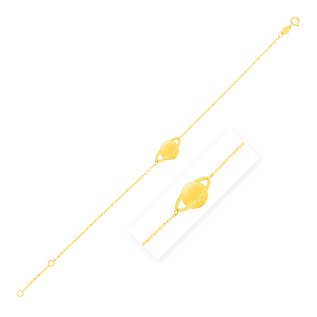 14k Gold Saturn Bracelet: Size: 7''. Explore the universe in luxury with this bright 14k gold saturn suspended on a bracelet of fine, sparkling chain. Bracelet is 7 inches long, 1mm wide, and closes with a spring ring clasp. S