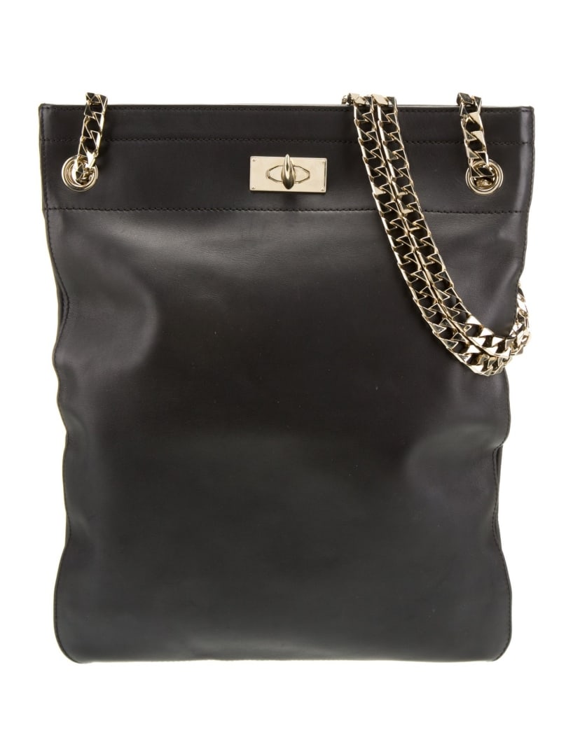 Givenchy Black Leather Chain-link Shoulder Bag: Condition is very good, pre-owned. Details: black leather, gold-tone hardware, chain-link shoulder straps, canvas lining, single interior pocket, turn-lock closure at front, shoulder strap drop: 12. 2